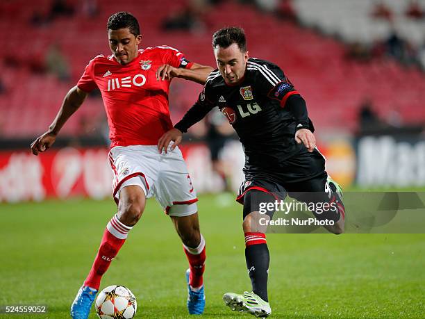 Benfica's defender Cesar vies for the ball with Leverkusen's forward Josip Drmic during the Champions League football match between SL Benfica and...