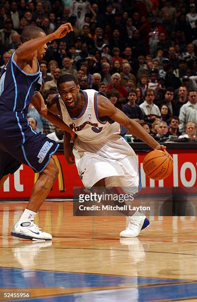 Gilbert Arenas of the Washington Wizards drives the basket in a game against the Utah Jazz March 19, 2005 at the MCI Center in Washington, DC. NOTE...