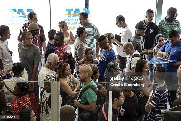 Job seekers wait in line at the Centro Apoio ao Trabalho government unemployment center in Sao Paulo, Brazil, on Monday, April 25, 2016. Brazil shed...