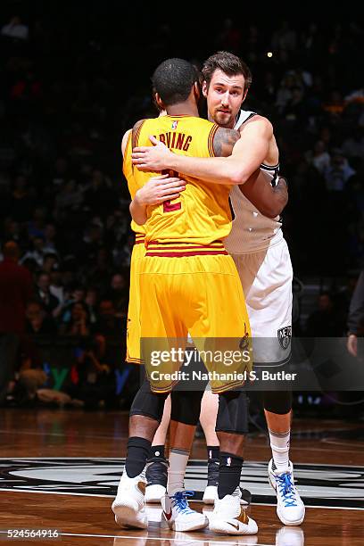 Kyrie Irving of the Cleveland Cavaliers hugs Sergey Karasev of the Cleveland Cavaliers on March 24, 2016 at Barclays Center in Brooklyn, New York....