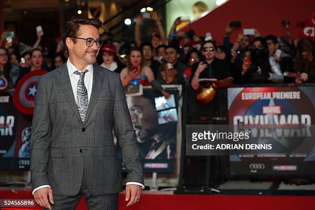 Actor Robert Downey Jr. Poses on the red carpet arriving for the European Premiere of the film Captain America: Civil War in London on April 26, 2016...