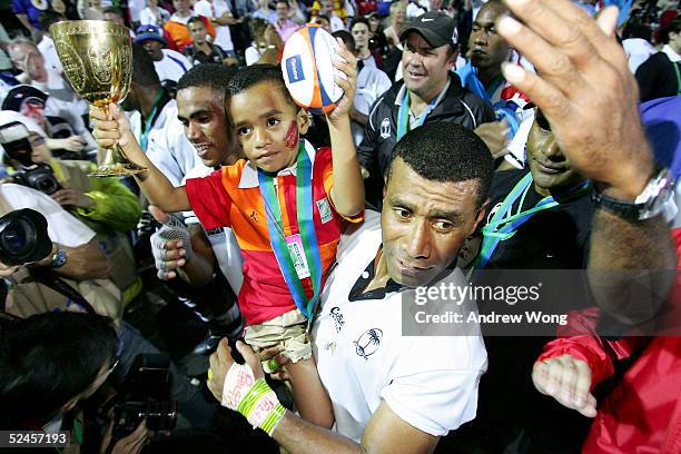 Captain Waisale Serevi of Fiji and his son Serevi Jr. Celebrate after after defeating New Zealand in the Melrose Cup Final on day three of the Rugby...