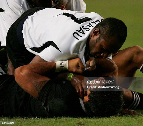 Vilimoni Delasau of Fiji scuffles with New Zealand's Liam Messam during the Cup Final on day three of the Rugby World Cup Sevens held at Hong Kong...