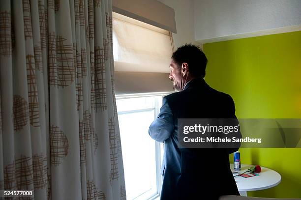 December 13, 2012 - JOHN MCAFEE IN HIS HOTEL ROOM. John McAfee talks to the media at the Beacon Hotel where he is staying after arriving last night...