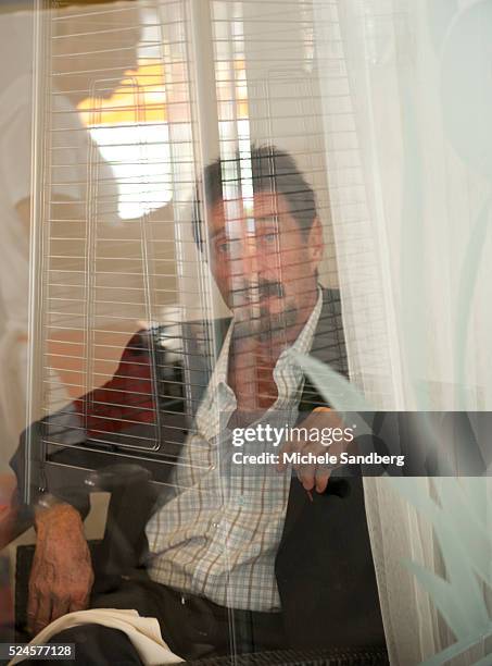 December 13, 2012 - John McAfee talks to the media at the Beacon Hotel where he is staying after arriving last night from Guatemala on December 13,...