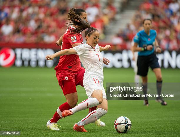 Melissa Tancredi of team Canada and Martina Moser of team Switzerland in 2015 women's World Cup Soccer in Vancouver during second round action...