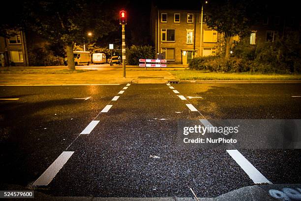 The Netherlands - Part of the entrance road to the university city is given a new top layer of asphalt. Such work is increasingly being done at...