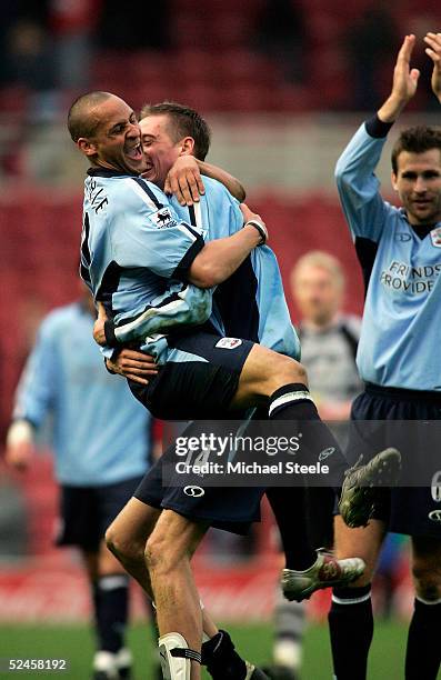 Peter Crouch of Southampton celebrates at the final whistle with Nigel Quashie during the Barclays Premiership match between Middlesbrough and...