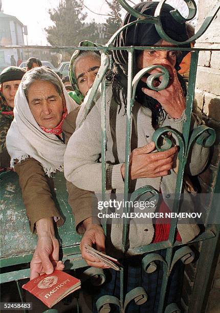 This picture taken in February 1994, shows Azeri refugees from Nagorny Karabakh waiting for bread delivery in the town of Imishly. Armenia has...