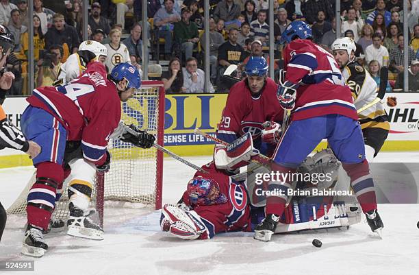 Goaltender Jose Theodore of the Montreal Canadiens makes a save during game 5 of the Stanley Cup play-offs against the Boston Bruins at the Fleet...