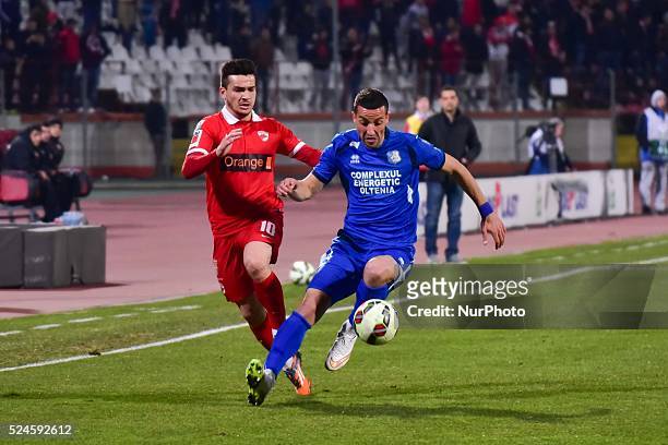 Cosmin Gabriel Matei of Dinamo Bucharest and Marko Momcilovic of CS Pandurii Targu Jiu in action during the League Cup Adeplast game between FC...