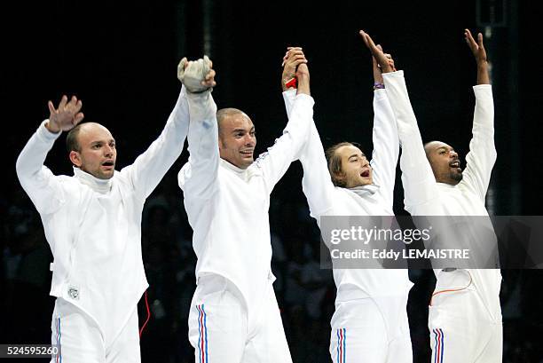 Athens 2004 - Olympic Games. Fencing. Men Team Sword final, France vs Hungaria. The French team is olympic champion. Left to right : Hughes Obry,...