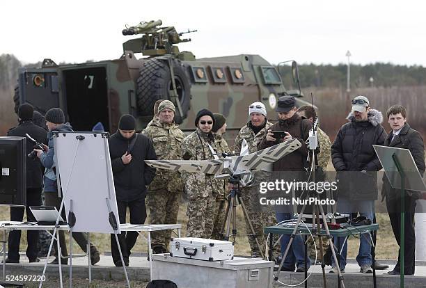 Serviceman of Ukrainian National Guard stand next to the latest ukrainian models of weapons and military equipment,during inspection of Ukrainian...
