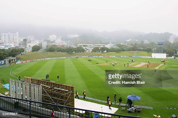 Groundstaff begin covering the wicket as fog and rain roll in to delay the start of play during day four of the 2nd Test between New Zealand and...