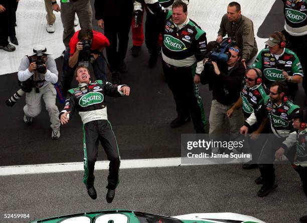 Carl Edwards, driver of the Roush Racing Ford, performs a backflip after winning the NASCAR Nextel Cup Golden Corral 500 on March 20, 2005 at the...