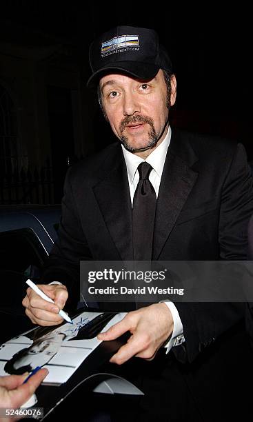 Actor Kevin Spacey signs autographs as he leaves One Knight Only, a variety performance in aid of the Asian Tsunami Appeal, at the Theatre Royal,...