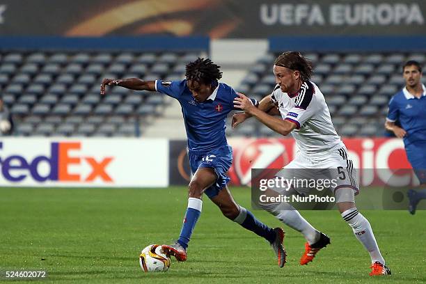 Belenenses's forward Kuca vies with Basel's defender Michael Lang during the UEFA Europa League Group I football match between Os Belenenses and FC...