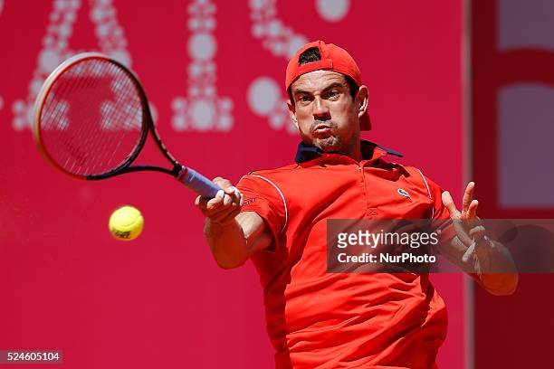 Spanish tennis player Guillermo Garcia-Lopez returns a ball to South African tennis player Kevin Anderson during their Millennium Estoril Open ATP...