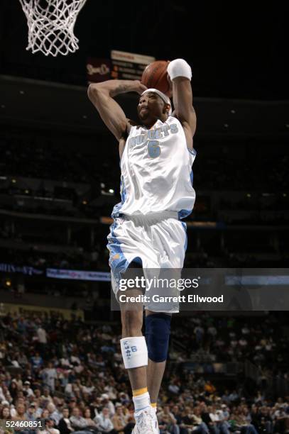 Kenyon Martin of the Denver Nuggets dunks against the Milwaukee Bucks on March 20, 2005 at the Pepsi Center in Denver, Colorado. The Nuggets defeated...