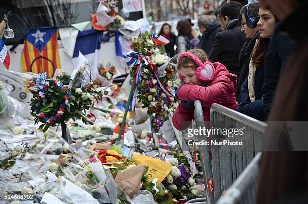 Little girl stay in front of the Bataclan concert hall in memorial of the victims of the terrorist attacks a month ago Paris, France on December 13,...