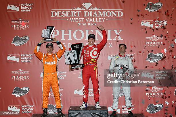 Scott Dixon of New Zealand, driver of the Target Chip Ganassi Racing Chevrolet IndyCar celebrates after winning the Phoenix Grand Prix alongside...