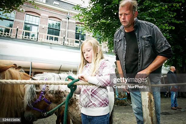 Horse dealers and their sticks used to keep the animals in place and calm. Every year on the 28th of July a horse market is held. The market...