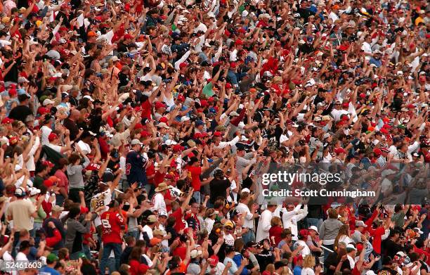 Fans on the frontstretch cheer Carl Edwards after winning the NASCAR Nextel Cup Series Golden Corral 500 at Atlanta Motor Speedway on March 20, 2005...