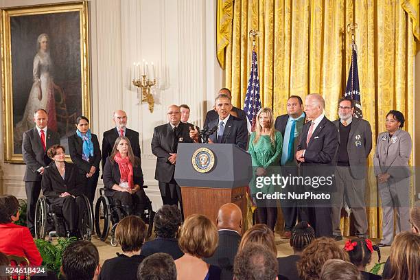 President Barack Obama speaks on reducing gun violence as Vice President JOe Biden looks on in the East Room of the White House on January 5, 2016 in...