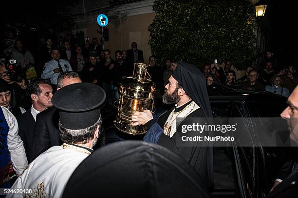 Orthodox Priests bring the Holy Ressurection Light from the Holy Sepulcher of Jerusalem to the Metochion of the Holy Sepulcher in Athens Plaka on...