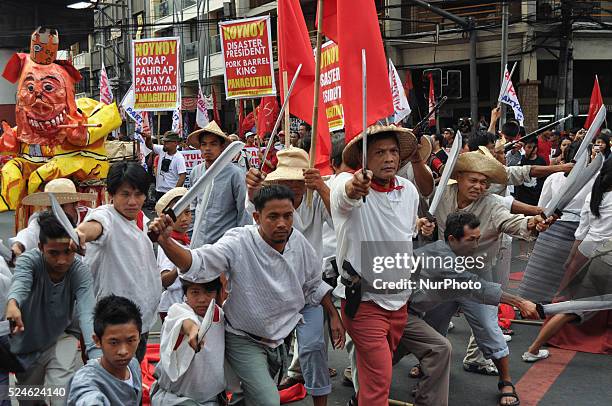 Actors re-enact events from history when Filipino patriot Andres Bonifacio led the Katipunan in revolution, as militant groups mark the hero's 150th...