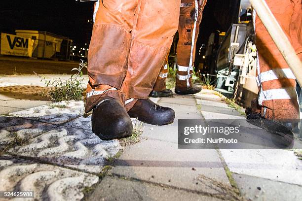 The Netherlands - Part of the entrance road to the university city is given a new top layer of asphalt. Such work is increasingly being done at...