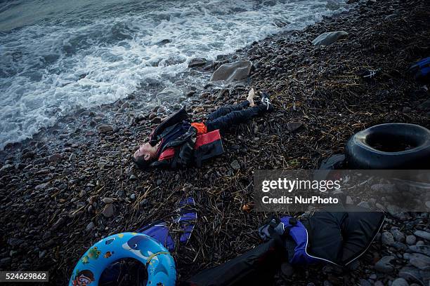 Boy lies dead on the shore of Skala Sikamineas after the sea washed him out. Lesbos, November 1, 2015.