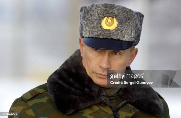 Portrait of Russian President Vladimir Putin, dressed in a fur-lined camouflage jacket and grey fur hat, following his inspection of the Plesetsk...