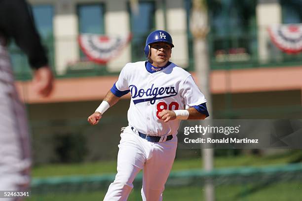 Infielder Oscar Robles of the Los Angeles Dodgers runs the bases against the Florida Marlins during MLB Spring Training on March 2, 2005 at Holman...