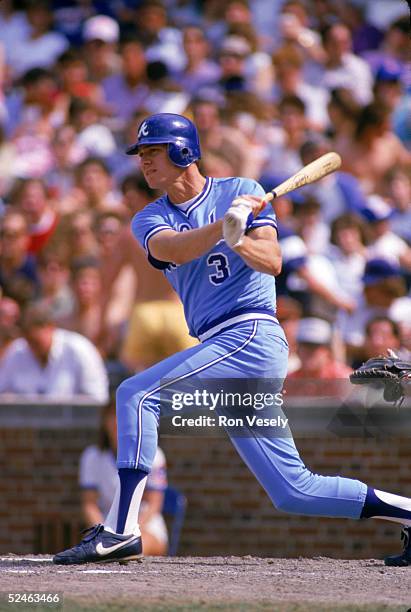 Dale Murphy of the Atlanta Braves follows through on his swing during a game against the Chicago Cubs in 1986 at Wrigley Field in Chicago, Illinois....