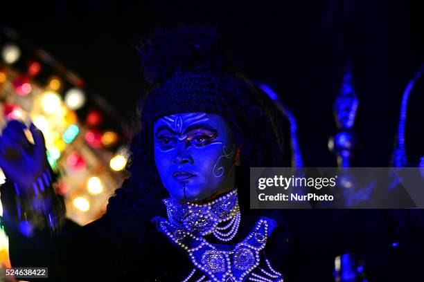 An Indian artist dressed as the Hindu Lord Shiva takes part in a 'Ravan ki Barat' procession held to mark the forthcoming Dussehra festival in...