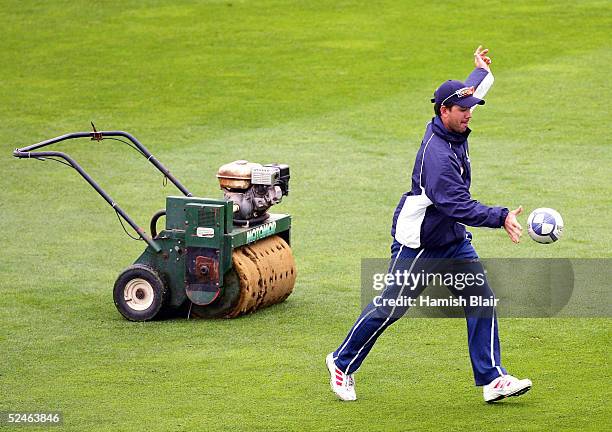 Ricky Ponting of Australia kicks a rugby ball as rain delays the start of play during day five of the 2nd Test between New Zealand and Australia...