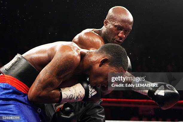 Souleymane M'Baye of France fights with Panama's Ameth Diaz during their boxing match at the Palais des Sport Marcel Cerdan in Levallois near Paris.