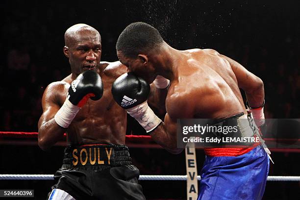 Souleymane M'Baye of France fights with Panama's Ameth Diaz during their boxing match at the Palais des Sport Marcel Cerdan in Levallois near Paris.