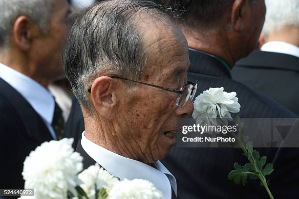 Philippines - Relatives of the fallen Japanese soldiers of WW2 offer flowers and prayers to their dead during a ceremony at a Japanese war memorial...