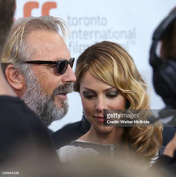 Kevin Costner and wife Christine Baumgartner arrive at the 'Black and White' premiere during the 2014 Toronto International Film Festival at Roy...