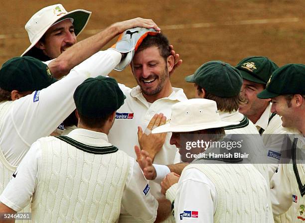 Michael Kasprowicz of Australia celebrates the wicket Lou Vincent of New Zealand his 100th Test wicket during day five of the 2nd Test between New...