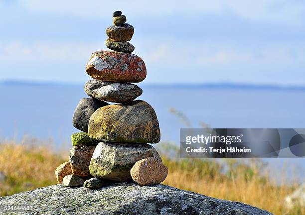 cairn overlooking the ocean - cairns stock pictures, royalty-free photos & images