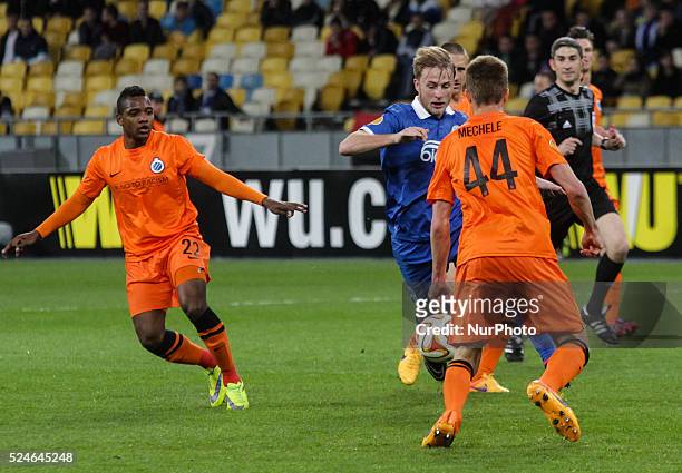 Roman Bezus of Dnipro vies for the ball with Brandon Mechele of Brugge during the UEFA Europa League quarter final second leg soccer match between...