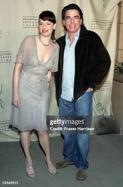 Actress Melinda Clarke and actor Peter Gallagher pose at The Academy of Arts and Sciences presents the "The O.C." Revealed at Warner Bros Studios...