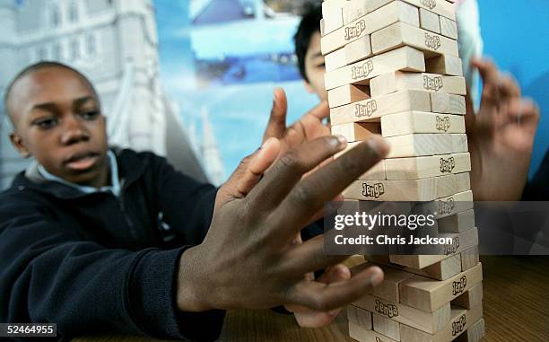 Alex Agboola and John Chua attempts to break his teams previous Jenga record of 30 levels in 11 minutes and 55 seconds at The Walkways, Tower Bridge...