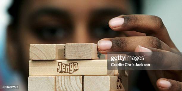 Sabrina Ibrahim works with her team in an attempt to break their teams previous Jenga record of 30 levels in 11 minutes and 55 seconds at The...