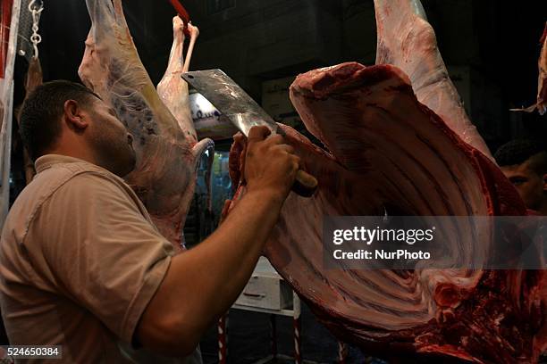 Muslims cutting sheep and cow as offering on Eid al-Adha sacrifice feast day in Cairo, Egypt on September 25, 2015