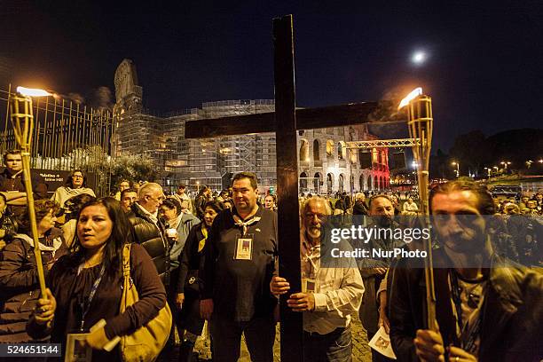 Thousands of Gypsies attend celebrations of the Via Crucis outside the Colosseum in Rome on October 24, 2015. Thousands of Gypsies have come from all...