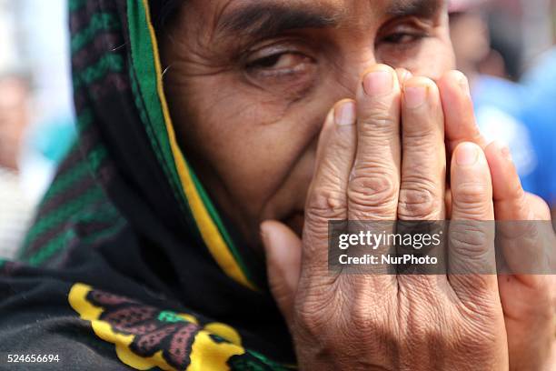 Bangladeshi relatives of victims of Rana Plaza, cry as they gather at the spot on the second anniversary of the garment factory building collapse in...